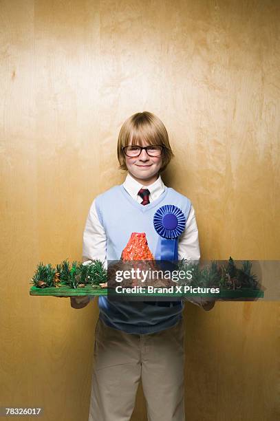 boy with prize winning model volcano - school award stock pictures, royalty-free photos & images