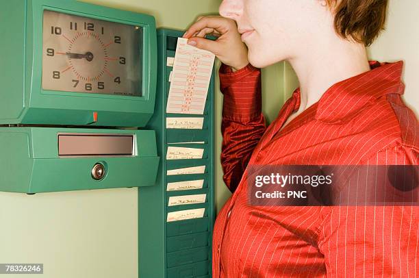 woman with time card - prikkaart stockfoto's en -beelden