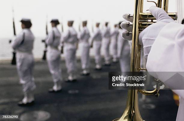 ceremonial honor guard members at sea burial - military ceremony stock pictures, royalty-free photos & images