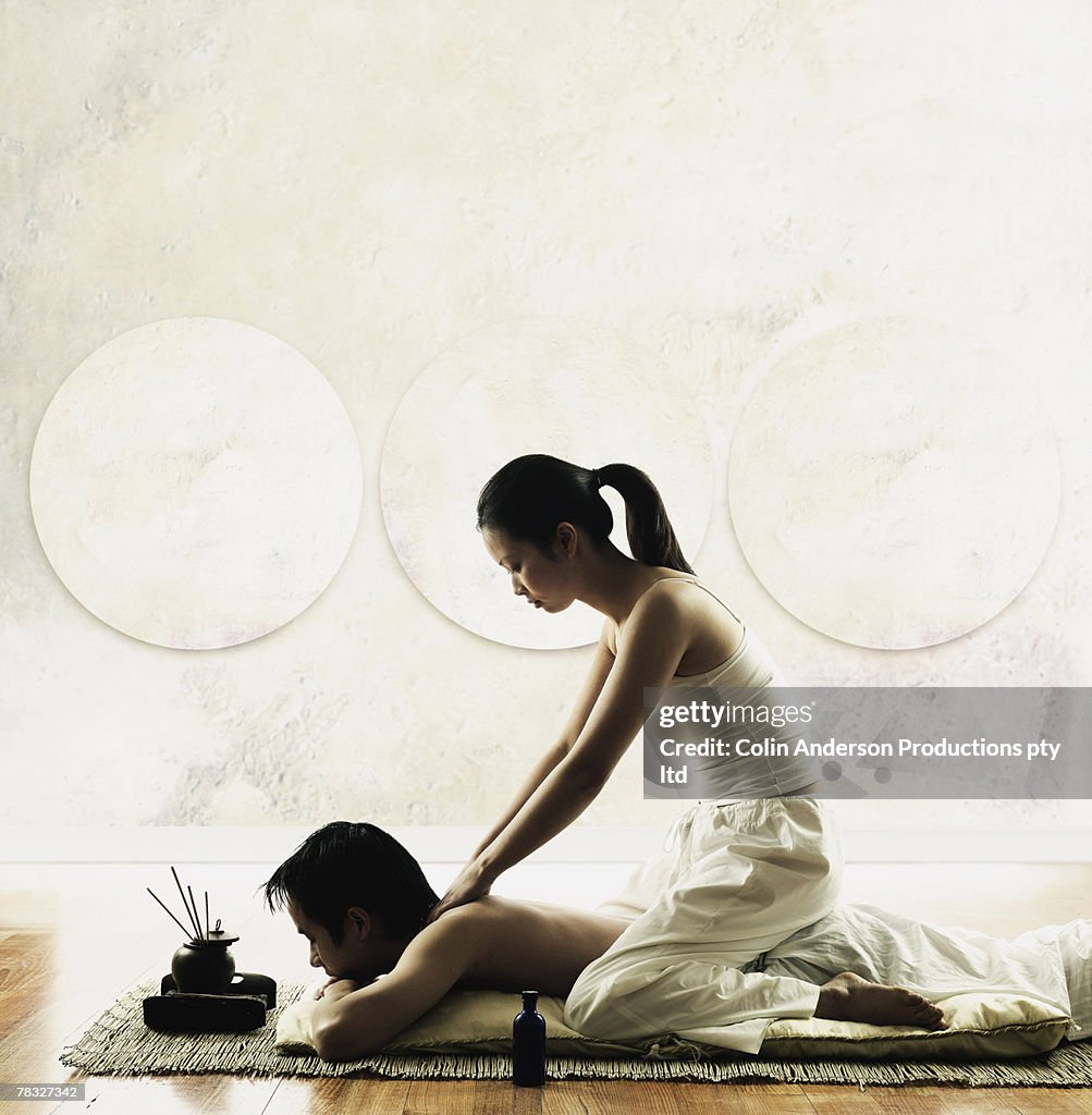 Woman giving a man a massage