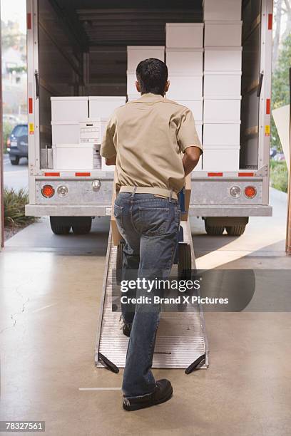 Delivery Rider Behind Lorry Walking Behind Truck Photos and Premium High Res Pictures - Getty Images