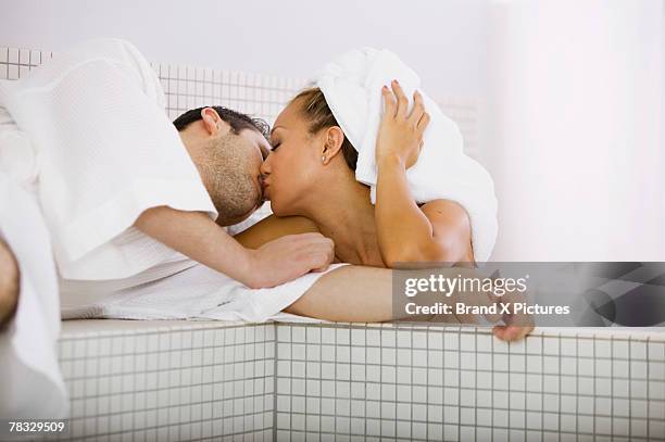 couple kissing in bathroom - couple and kiss and bathroom stock-fotos und bilder