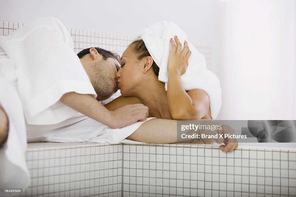 Couple kissing in bathroom