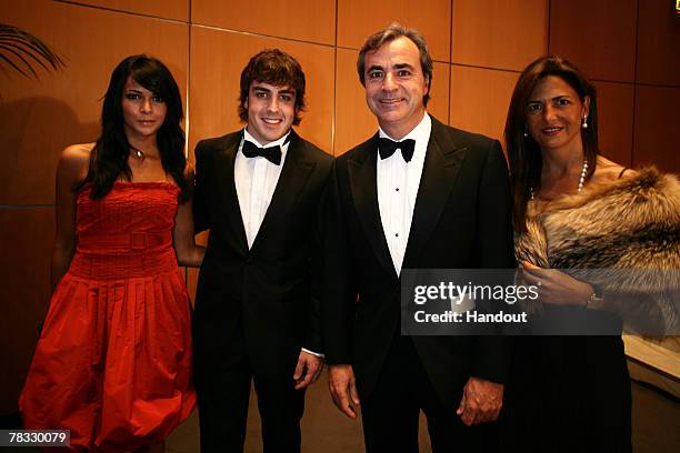 In this handout image provided by FIA, Fernando Alonso and wife and rally driver Carlos Sainz and his wife attend the 2007 FIA Gala Prize Giving...