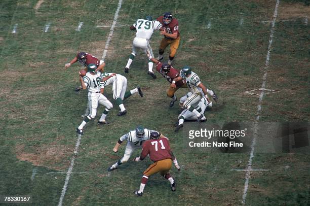 Quarterback Norm Snead of the Philadelphia Eagles drops back to pass against the Washington Redskins at RFK Stadium on October 6, 1968 in Washington,...