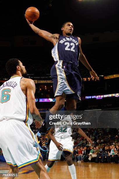 Rudy Gay of the Memphis Grizzlies dunks the ball over Tyson Chandler of the New Orleans Hornets on December 7, 2007 at the New Orleans Arena in New...