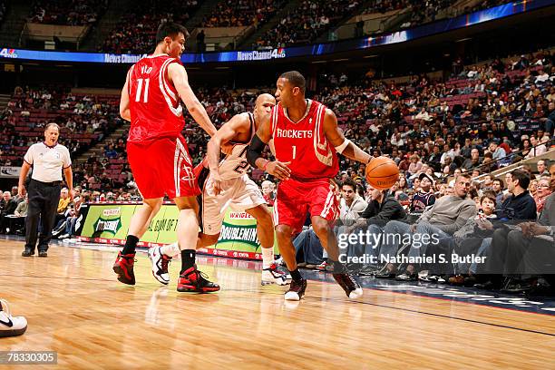 Yao Ming of the Houston Rockets defends against Richard Jefferson of the New Jersey Nets for teammate Tracy McGrady on December 7, 2007 at the IZOD...