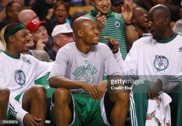 Paul Pierce, Ray Allen and Kevin Garnett of the Boston Celtics tries have fun on the bench in the fourth quarter against the Toronto Raptors on...