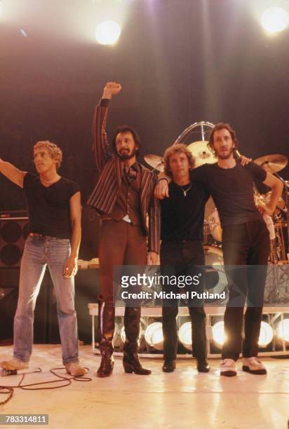 From left, Roger Daltrey, John Entwistle, Kenney Jones and Pete Townshend of The Who wave to fans and audience members from the stage at the end of a...