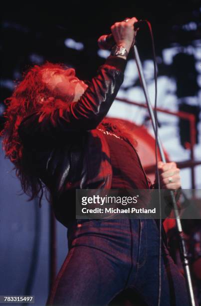 English singer David Coverdale performs live on stage with British heavy metal band Whitesnake at the Monsters of Rock festival at Donington Park,...
