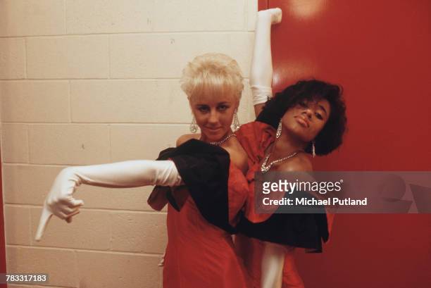 Backing singers Pepsi and Shirlie, performing with pop duo Wham!, pictured backstage together in Australia during 'The Big Tour' in January 1985....