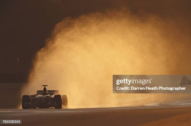 Pedro de la Rosa of Spain drives the Jaguar Racing F1 Team R3 Cosworth CR-3 in the wet during Formula One pre season testing on 10 January 2000 at...