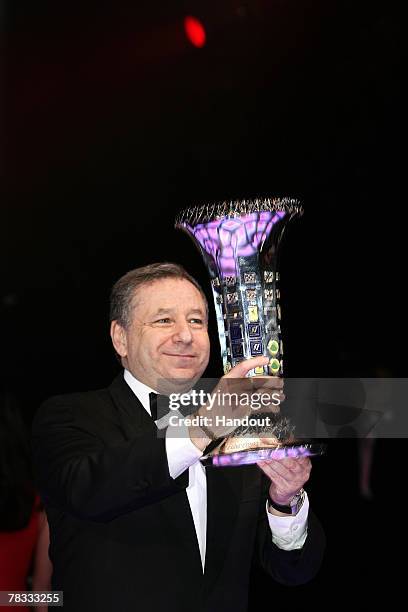 In this handout image provided by FIA, Executive Director of Scuderia Ferrari Jean Todt holds the Formula One Constructors Trophy during the 2007 FIA...