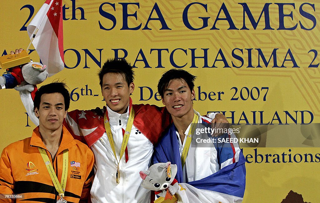 Singapore's Zhirong BryanTay (C) poses w
