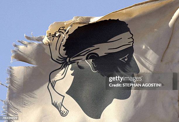 Picture taken 08 December 2007, shows a ripped flag floating over Ajaccio's harbour, on the eve of the arrival in Corsica amid tight security of...