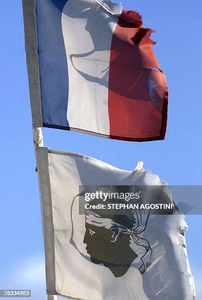 Picture taken 08 December 2007, shows two ripped flags floating over Ajaccio's harbour, on the eve of the arrival in Corsica amid tight security of...