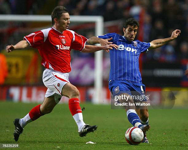 Matt Holland of Charlton Athletic tries to tackle Pablo Counago of Ipswich Town during the Coca-Cola Championship match between Charlton Athletic and...