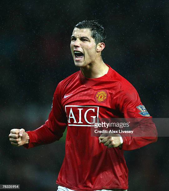 Cristiano Ronaldo of Manchester United celebrates scoring his team's fourth goal from the penalty spot during the Barclays Premier League match...