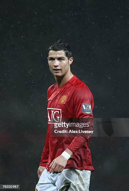 Cristiano Ronaldo of Manchester United looks on as the rain pours during the Barclays Premier League match between Manchester United and Derby County...