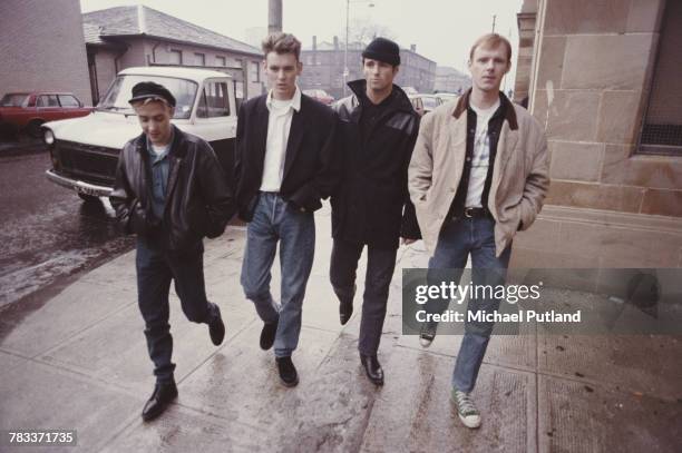 Scottish group Wet Wet Wet pictured walking along a street in Glasgow, Scotland in 1987. The group are, from left, Neil Mitchell, Graeme Clark, Marti...