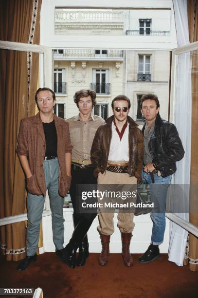 British new wave group Ultravox posed together in Paris, France in 1982. Left to right: keyboard player Billy Currie, drummer Warren Cann, singer...