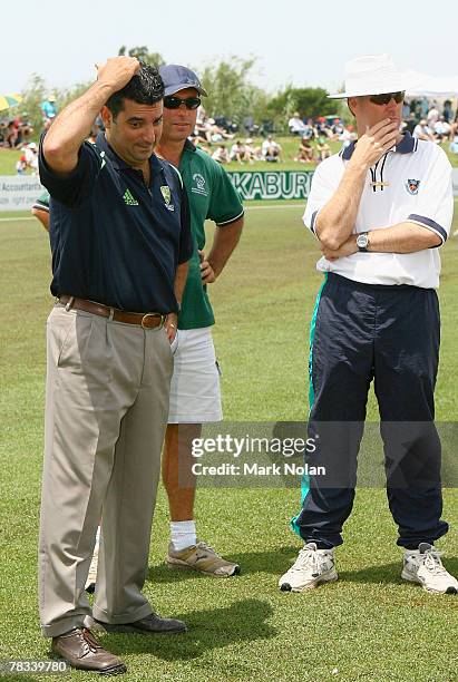 Match officials inspect the outfield before abandoning play in the Ford Ranger Cup match between the NSW Blues and the South Australian Redbacks at...
