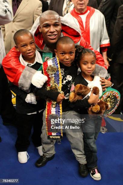 Floyd Mayweather Jr. Celebrates with his children Shamaree Mayweahter, Koraun Mayweather and Iyanna Mayweather after his 10th round knockout of Ricky...