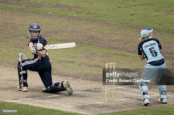 Kelly Applebee of the Spirit plays a shot as Breakers wicketkeeper Leonie Coleman looks on during the WNCL match between the Victoria Spirit and the...