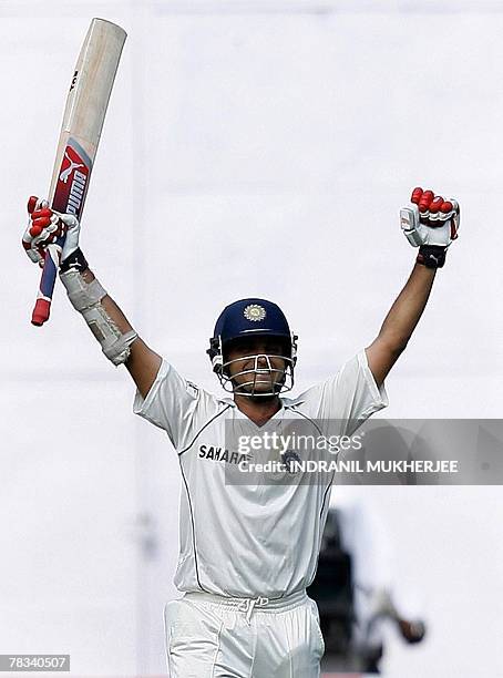 Indian cricketer Sourav Ganguly celebrates after scoring a double century on the second day of the third Test between India and Pakistan at the...