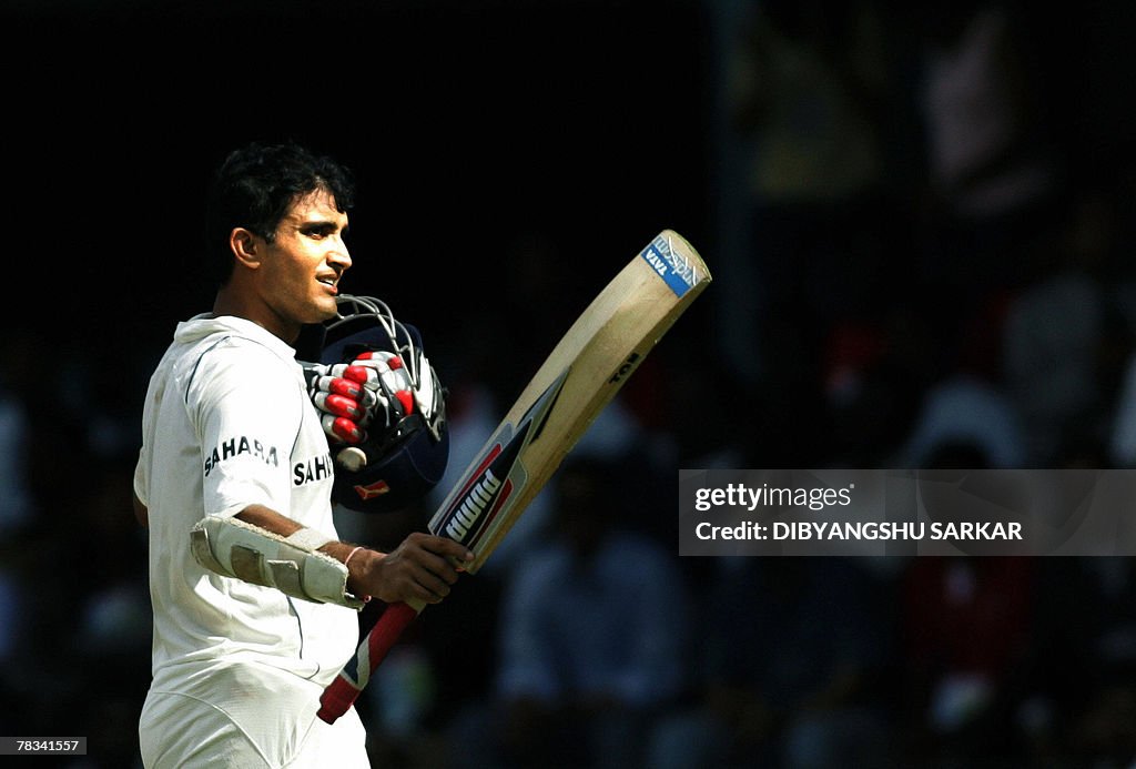 Indian cricketer Sourav Ganguly walks ba
