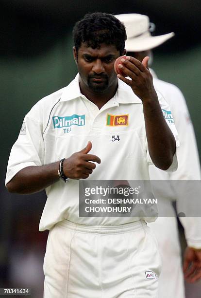 Sri Lankan cricketer Muttiah Muralitharan prepares to deliver a ball during the first day of the second Test match at the Sinhalese Sports Club...