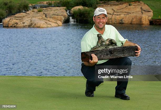 John Bickerton of England poses with the trophy after winning The Alfred Dunhill Championship at The Leopard Creek Country Club on December 9, 2007...