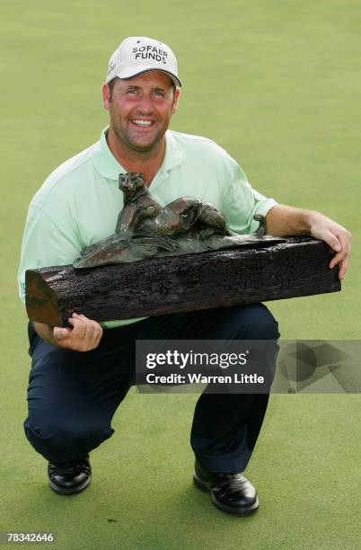 John Bickerton of England poses with the trophy after winning The Alfred Dunhill Championship at The Leopard Creek Country Club on December 9, 2007...