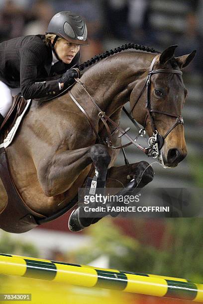 Germany's Meredith Michaels-Beerbaum on Shutterfly clears an obstacle to capture the second place ex-aequo during the FEI World Cup Grand Prix 09...