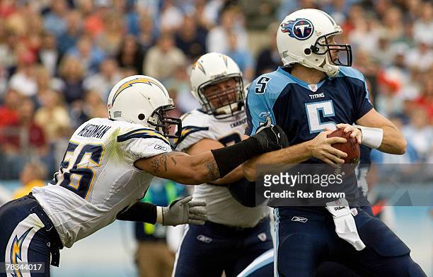 Kerry Collins of the Tennessee Titans is sacked by Shawne Merriman of the San Diego Chargers during the fist half at LP Field on December 9, 2007 in...