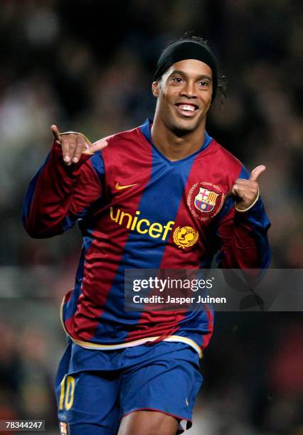 Ronaldinho of Barcelona celebrates his opening goal during the La Liga match between Barcelona and Deportivo La Coruna at the Camp Nou Stadium on...