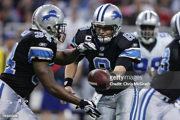 Quarterback Jon Kitna of the Detroit Lions hands off to teammate Kevin Jones against the Dallas Cowboys on December 9, 2007 at Ford Field in Detroit,...