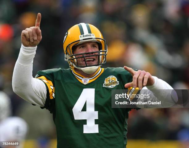 Brett Favre of the Green Bay Packers celebrates a touchdown pass against the Oakland Raiders on December 9, 2007 at Lambeau Field in Green Bay,...