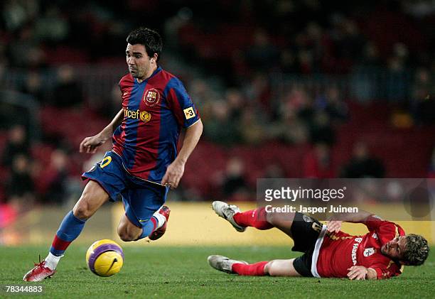 Deco of Barcelona controls the ball leaving Cristian Gonzalez of Deportivo la Coruna behind during the La Liga match between Barcelona and Deportivo...