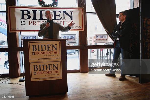 Democratic Presidential hopeful Sen. Joe Biden fields questions as his son Hunter Biden looks on at a campaign stop at 180 Main Pub and Restaurant...