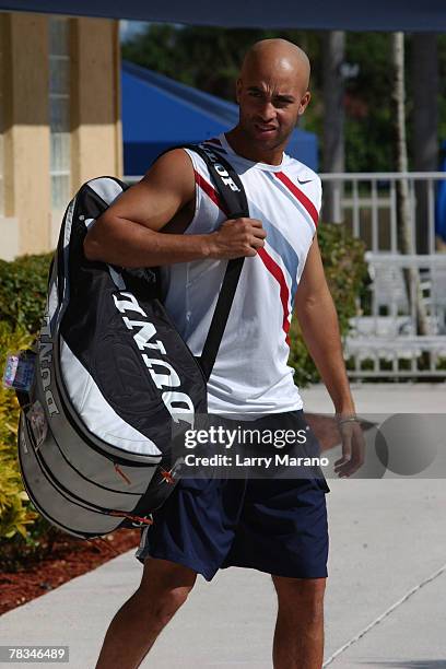 James Blake walks to the court for his mixed doubles at the Andy Roddick Foundation Celebrity Tennis Exhibition on December 9, 2007 in Boca Raton...