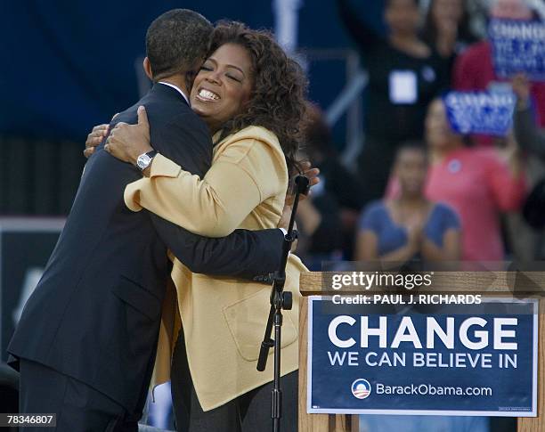 Illinois Senator and Democratic presidential hopeful Barack Obama gets a hugs from television host Oprah Winfrey, 09 December 2007 inside the...