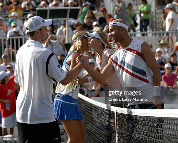 Andy Roddick shakes hands with James Blake after the match at the Andy Roddick Foundation Celebrity Tennis Exhibition on December 9, 2007 in Boca...