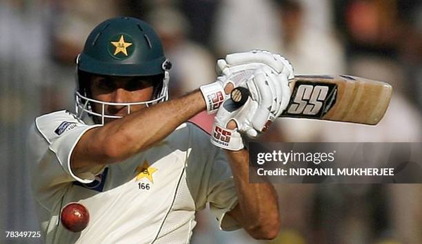 Pakistani cricketer Misbah-ul-Haq plays a shot on the third day of the third Test match between India and Pakistan at the Chinnaswamy stadium in...