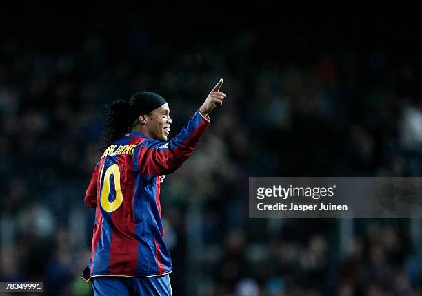 Ronaldinho of Barcelona celebrates his opening goal during the La Liga match between Barcelona and Deportivo La Coruna at the Camp Nou Stadium on...