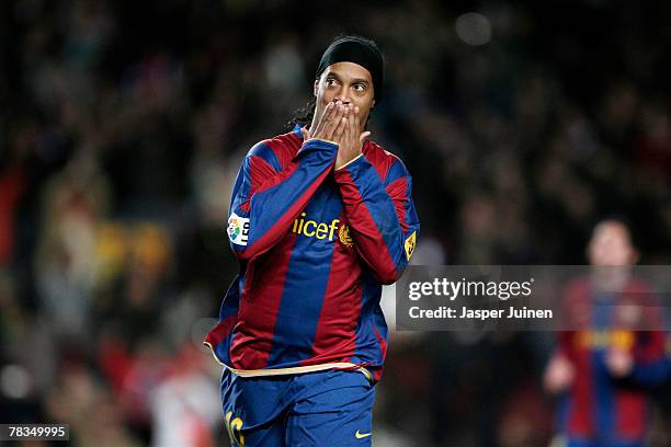 Ronaldinho of Barcelona celebrates his opening goal during the La Liga match between Barcelona and Deportivo La Coruna at the Camp Nou Stadium on...