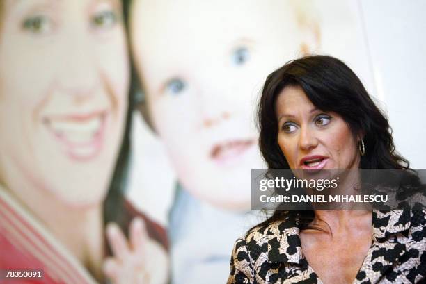 Former Romanian gymnast Nadia Comaneci addresses to the media during a press conference at the launching of the "Nadia Comaneci Foudation" charity...