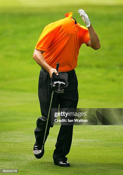 Jose-Maria Olazabal of Spain reacts to a lucky shot on the 13th hole during the First Round of the BMW Championship at The Wentworth Club on May 24,...