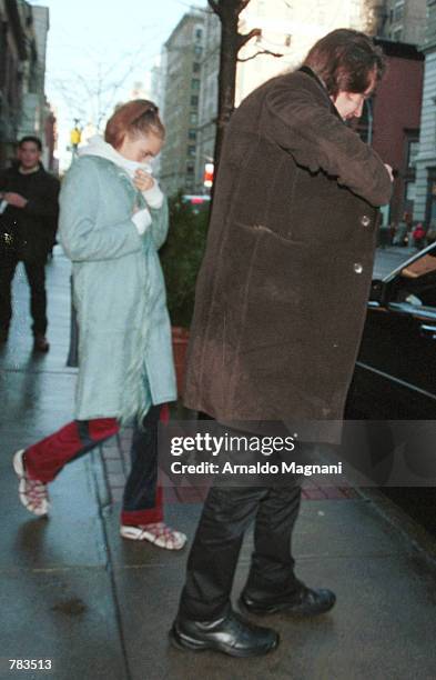 Elizabeth Jagger, left, the daughter of Rolling Stone Mick Jagger, walks to a car with a friend January 30, 2001 in New York City after having lunch...