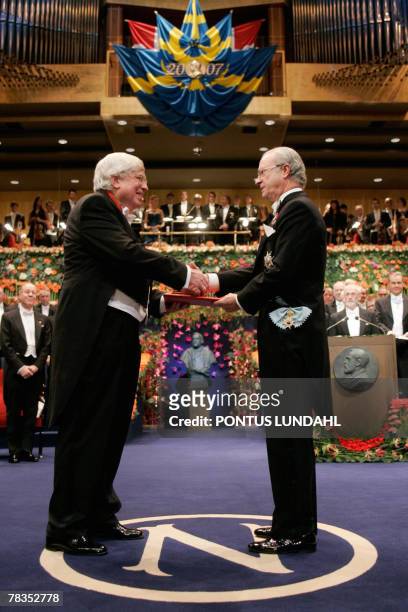 Gerhard Ertl of Germany receives the 2007 Nobel Prize in Chemistry from King Carl XVI Gustaf of Sweden for his studies of chemical processes on solid...